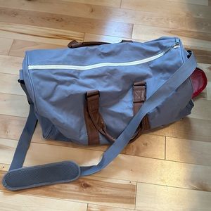 duffle bag, one zip broken